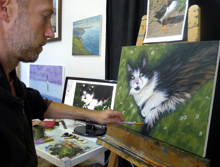 cat portrait painting on the easel
