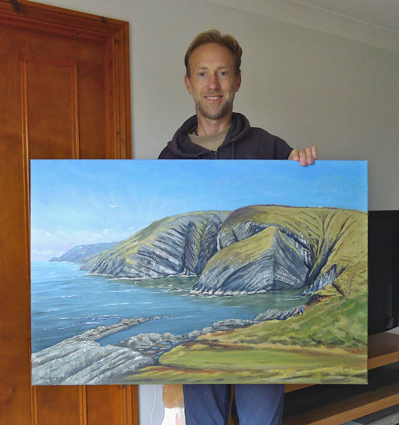 Oil painting of Ceibwr bay hanging on the wall