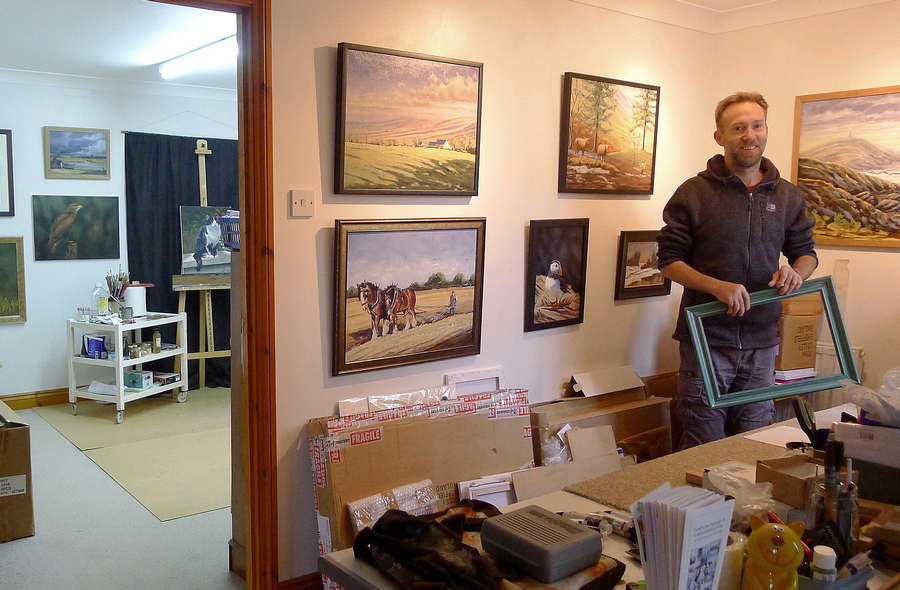 Artist Chris Chalk standing in his art studio in west Wales